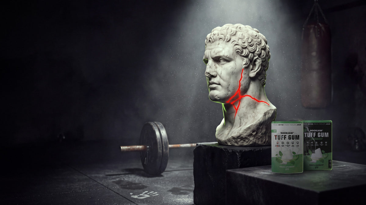 Marble bust with a red glowing crack beside Tuff Gum pouches